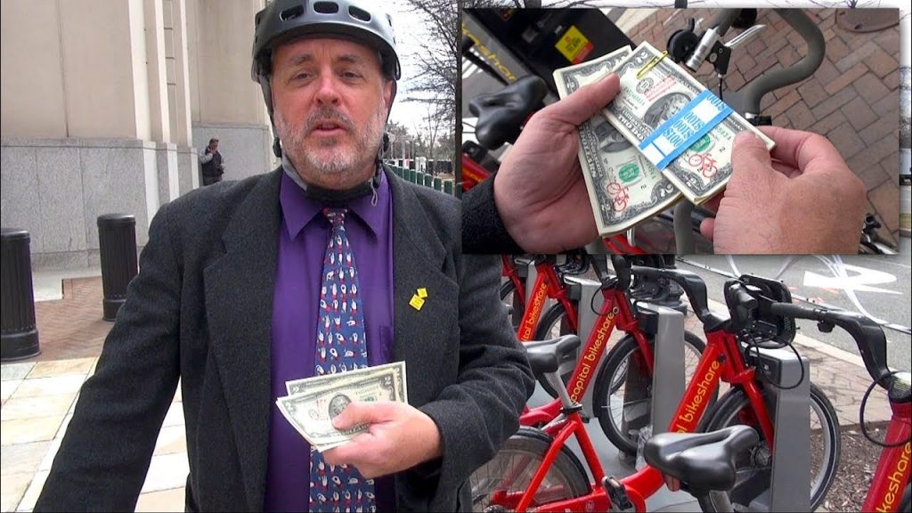 See What this Cyclist is Doing with $2 Bills to Advocate for Cycling
